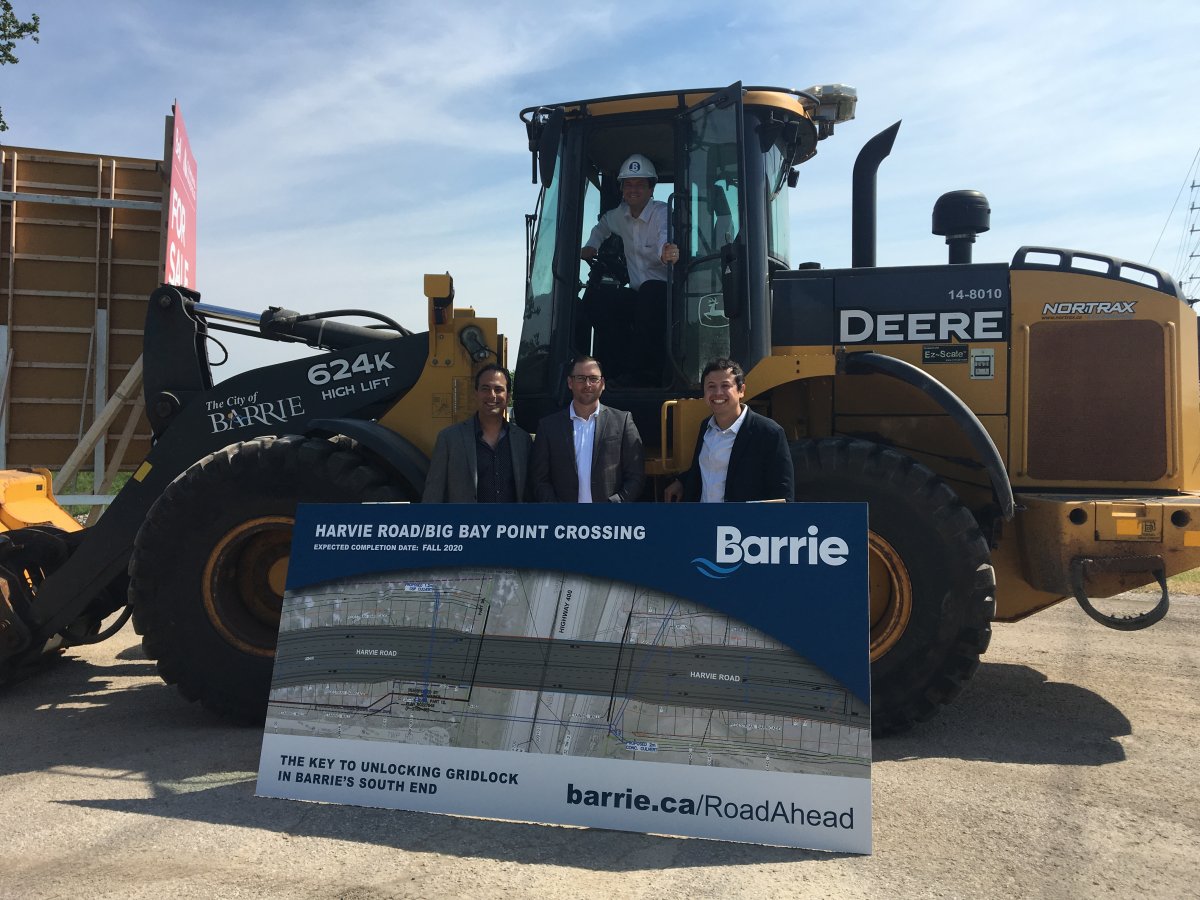 Mayor Jeff Lehman (above), poses with city Councillors Arif Khan (left), Andrew Prince (centre), and Sergio Morales (right), at the Harvie Road and Big Bay Point Road overpass ground breaking.