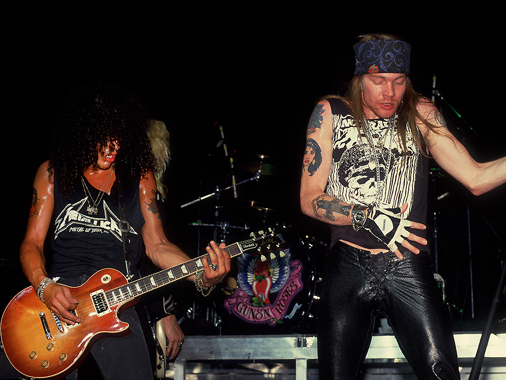 Guns N' Roses perform at the Poplar Creek Music Theater in Hoffman Estates, Illinois, on July 19, 1988. 