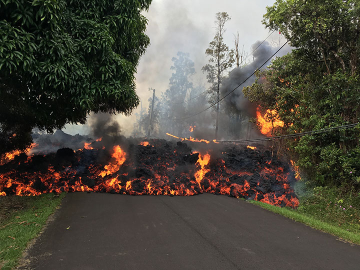 Lava flows from the crater of Kilauea volcano as dozens of structures have been destroyed by scorching lava flows following a massive volcano eruption on Hawaii’s Big Island, May 6, 2018.
