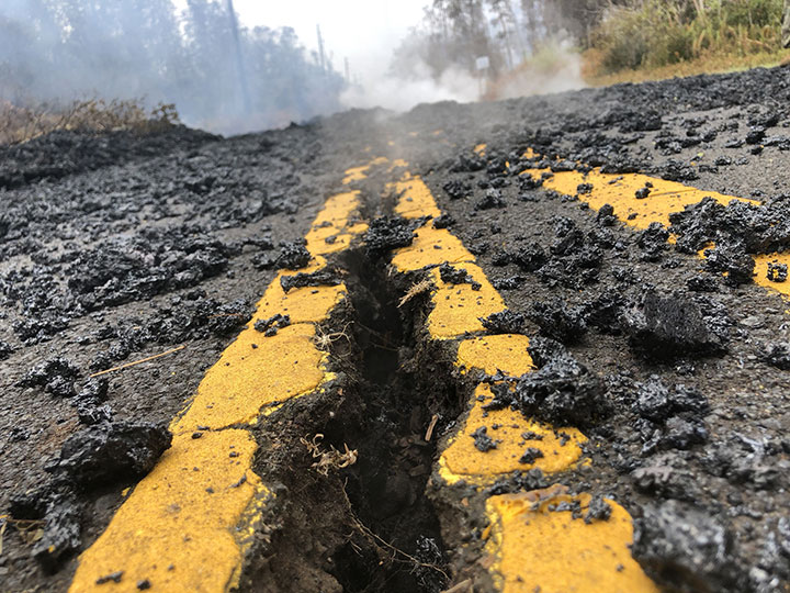 Cracks and volcanic debris are seen on a road in Leilani Estate, Hawaii, U.S., May 9, 2018.