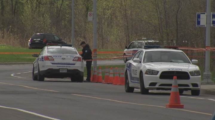 Montreal police investigate after the body of a man was discovered in a ditch in an industrial park in Saint-Laurent on Friday, May 11, 2018.
