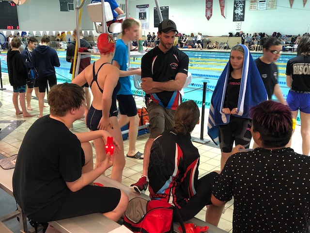 Nick Popiel speaks to his swim team at the Pan Am Pool on Saturday, May 26, 2018.