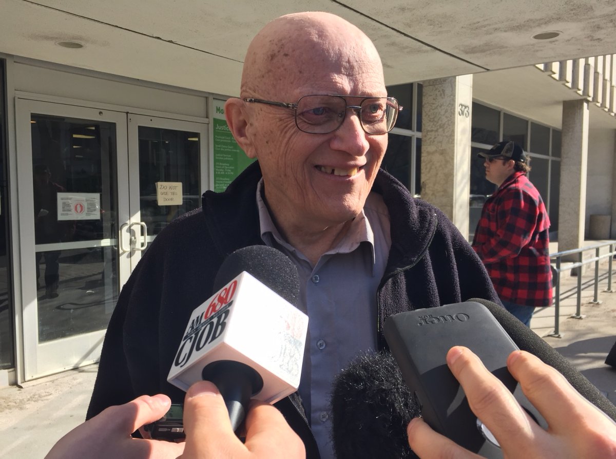 James Aisaican-Chase talks to reporters outside Manitoba Traffic Court on Broadway in Winnipeg. 