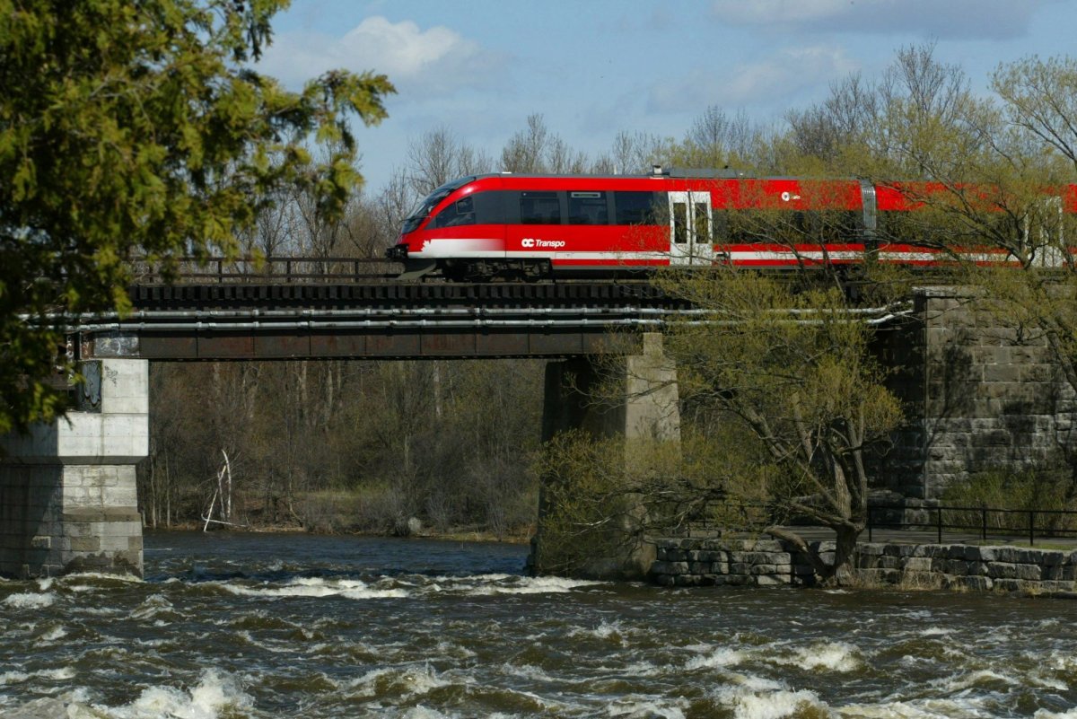 The OC Transpo light rail train makes its way through Ottawa on Friday, May 3, 2002.