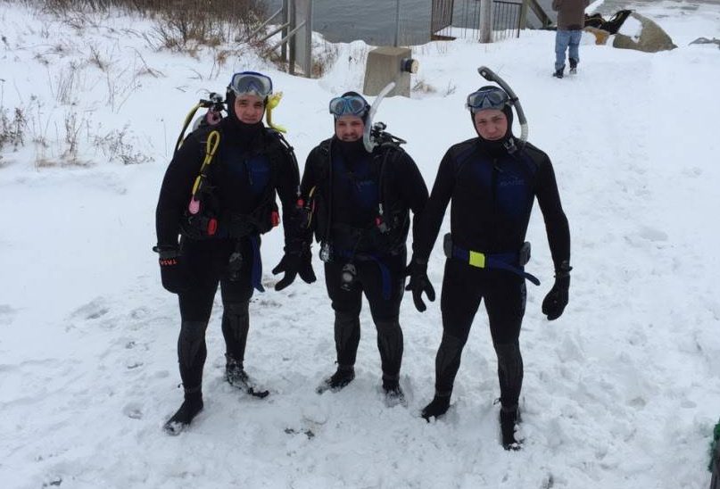 Even with snow on the ground, scuba divers in Nova Scotia prepare to enter the frigid water.