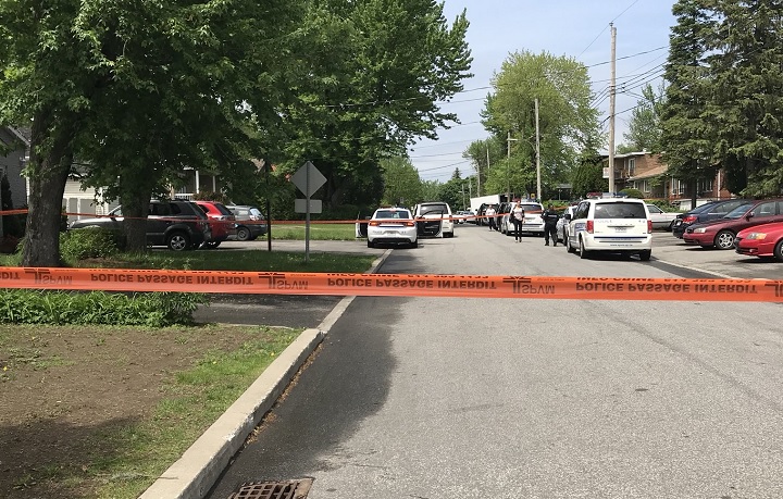 Montreal police investigate the city's 11th homicide of 2018 on Saturday, May 26, 2018. A 33-year-old man is expected to face first-degree murder charges in Quebec court on Monday.