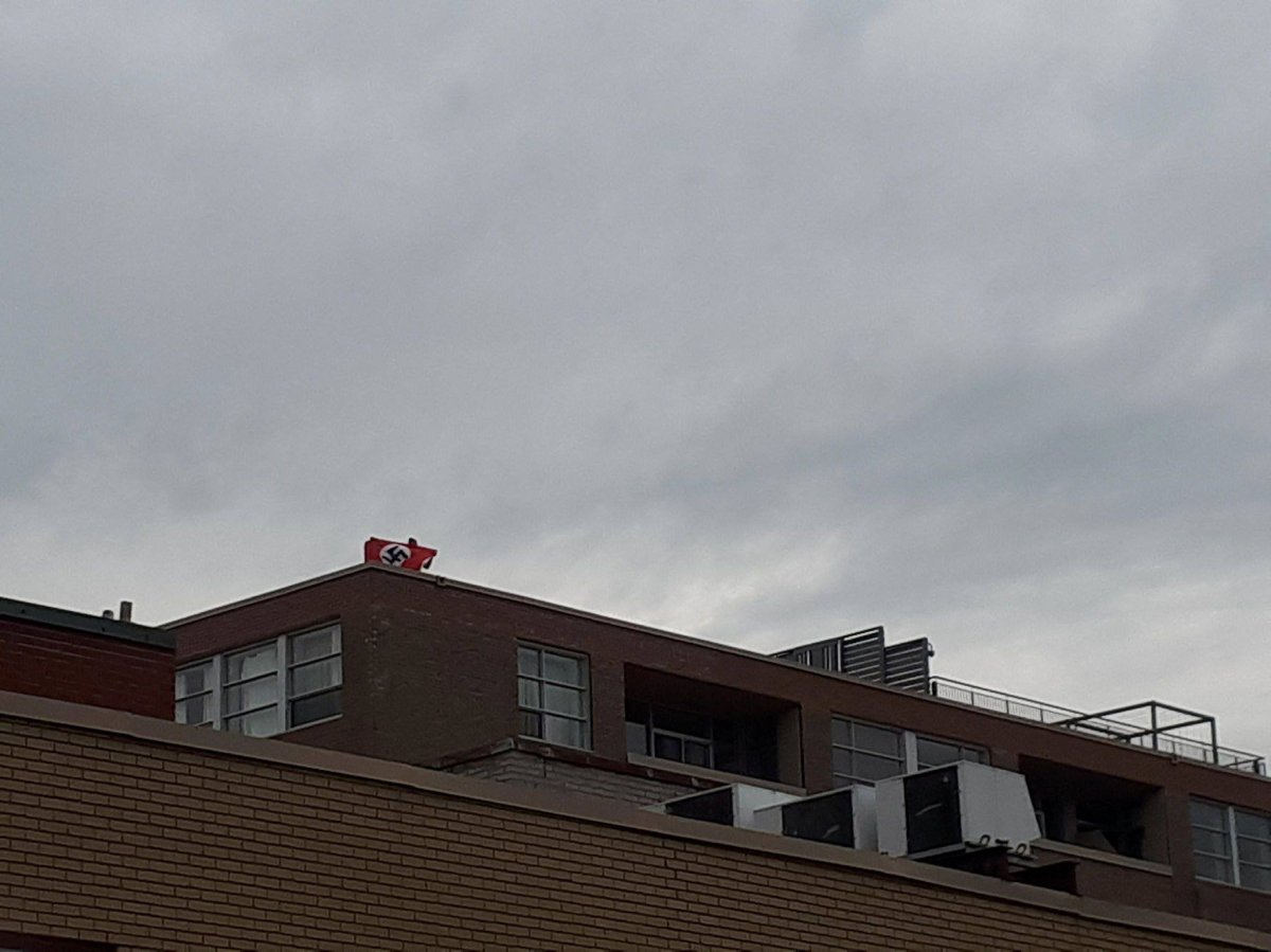 A Nazi flag is seen during May Day protests in Montreal.