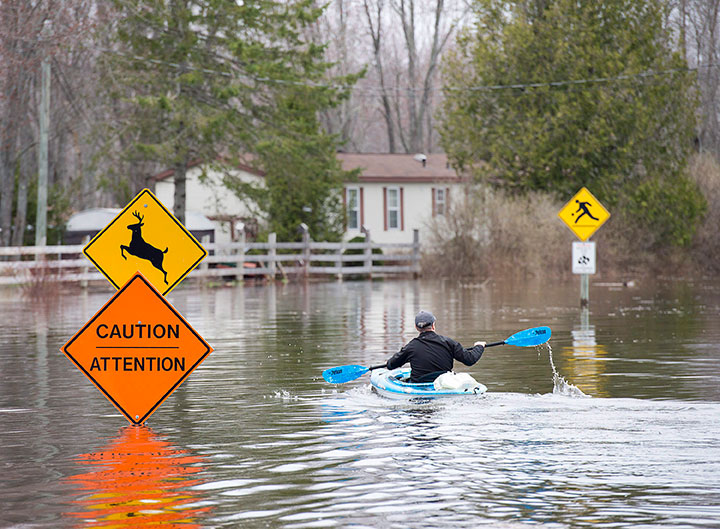 A resident paddles his kayak at Darlings Island, N.B. on Thursday, May 3, 2018.