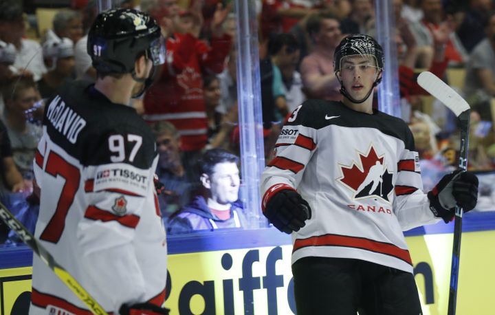 Canada's Ryan Nugent-Hopkins, right, celebrates with Connor McDavid, left, after scoring his sides second goal during the Ice Hockey World Championships group B match between Canada and Germany at the Jyske Bank Boxen arena in Herning, Denmark, Tuesday, May 15, 2018. 