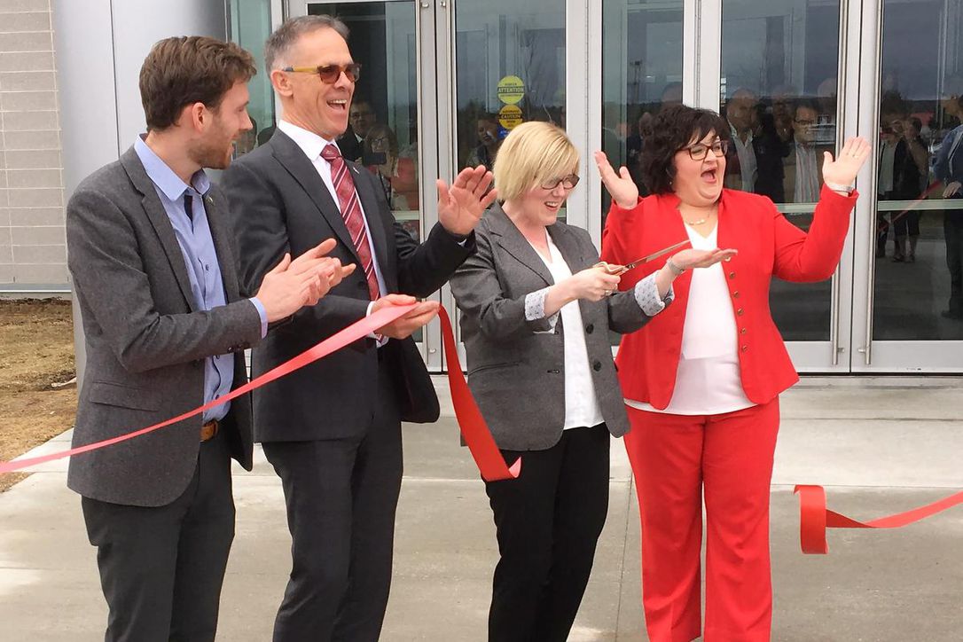 Miramichi mayor Adam Lordon Public, Liberal MP for Miramichi-Grand Lake Pat Finnigan, federal Services Minister Carla Qualtrough and New Brunswick Minister of Seniors and Long-Term Care Lisa Harris take part in a ribbon-cutting ceremony as they open the centralized Public Service Pay Centre in Miramichi, N.B., on Friday. 