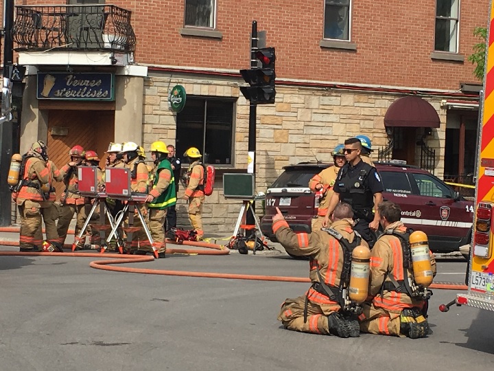Firefighters battle blaze in building housing l'Anecdote, a popular restaurant on Rachel Street in the Plateau. Saturday, May 26, 2018.