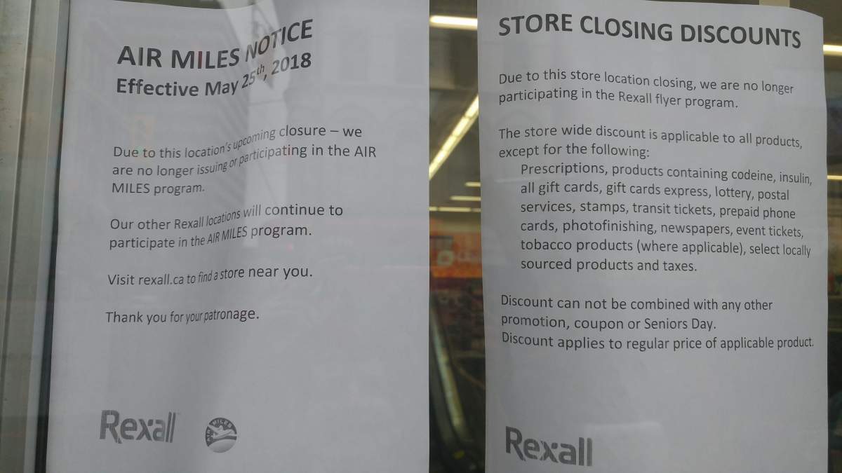 Signs at the entrance inform customers of changes at the location during store closing sales.