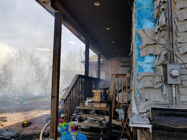 A home was extensively damaged as Saskatoon firefighters battled their second grass fire in 24 hours.