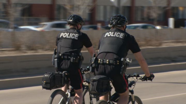 Members of the Saskatoon police bike unit arrest man riding a stolen bike on the sidewalk.