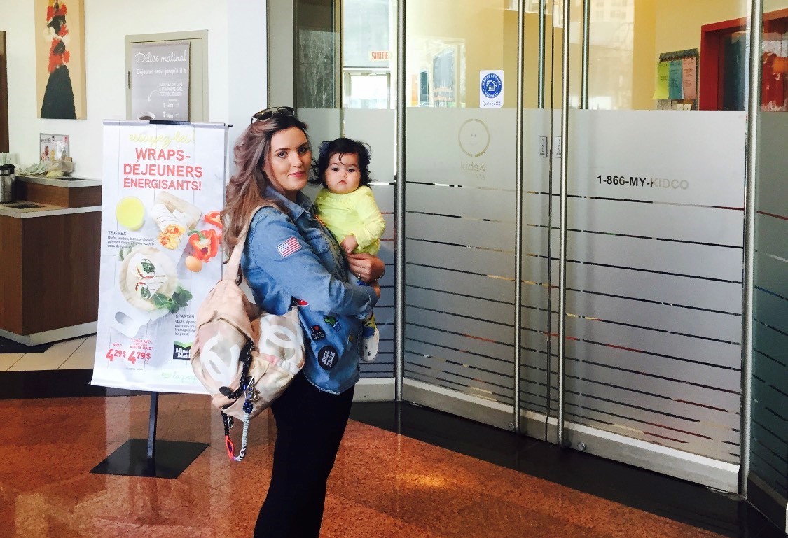 Kawtar Afiri and her daughter, Sofia, stand outside the Kids & Company daycare.