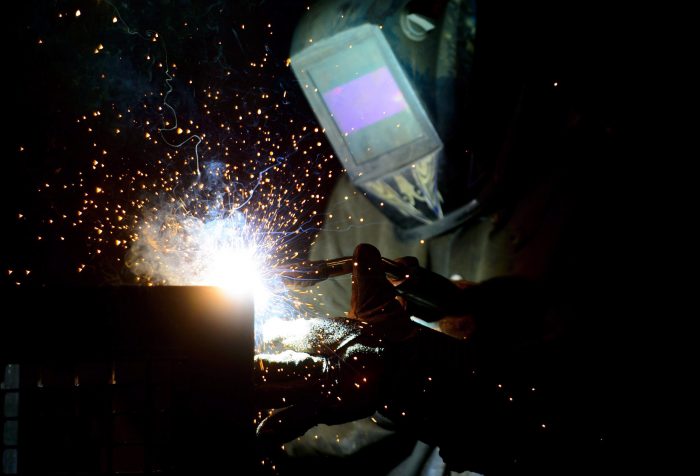 A welder fabricates a steel structure at an iron works facility in Ottawa on Monday, March 5, 2018. 