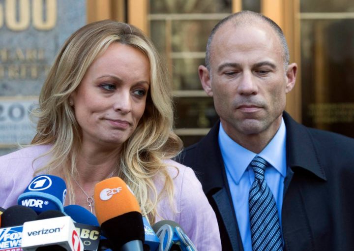 In this April 16, 2018, file photo, adult film actress Stormy Daniels, left, stands with her lawyer Michael Avenatti as she speaks outside federal court in New York. 