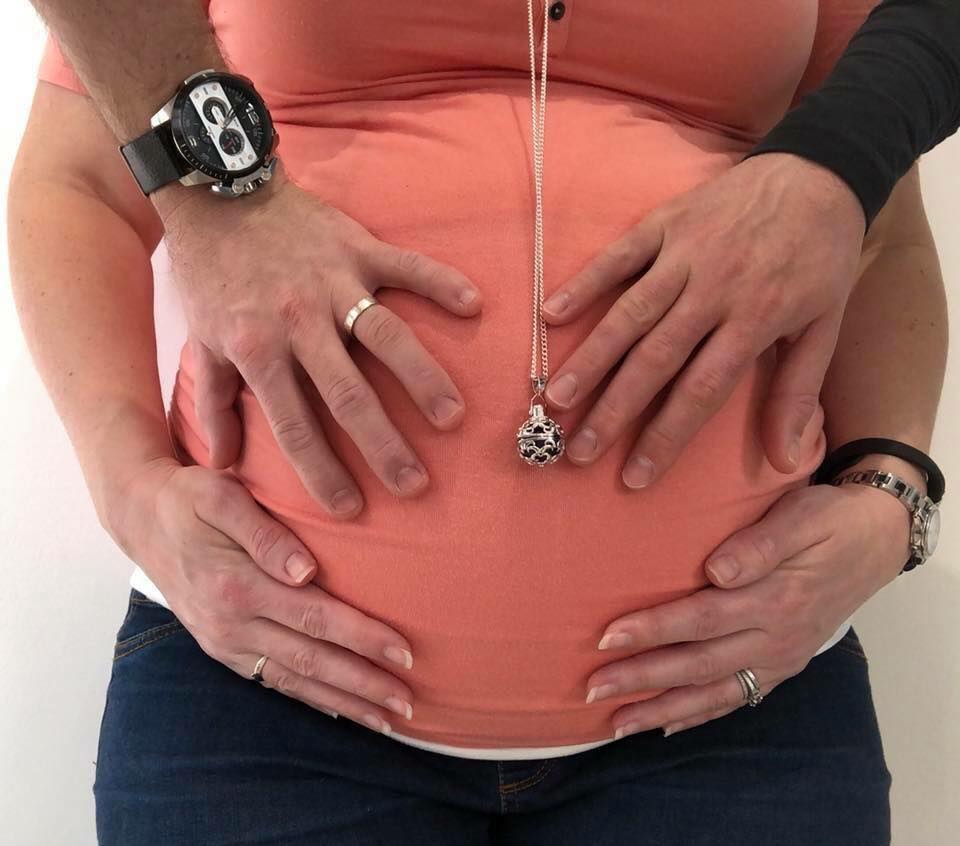 Canadian surrogate Stephanie Aubry poses while pregnant with the baby’s intended parents.