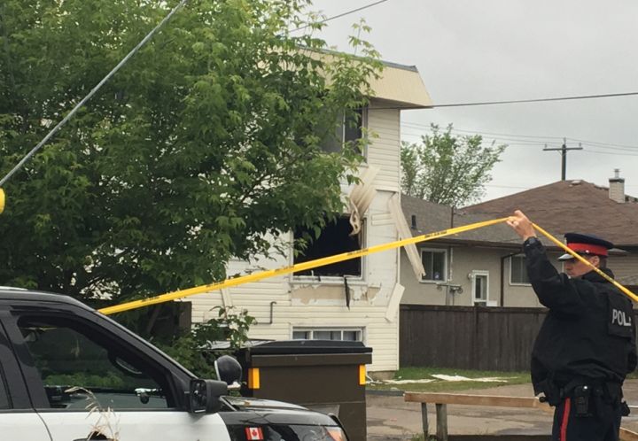 Edmonton police are seen at the scene of a suspicious fire in the area of 80 Street and 117 Avenue on May 30, 2018.