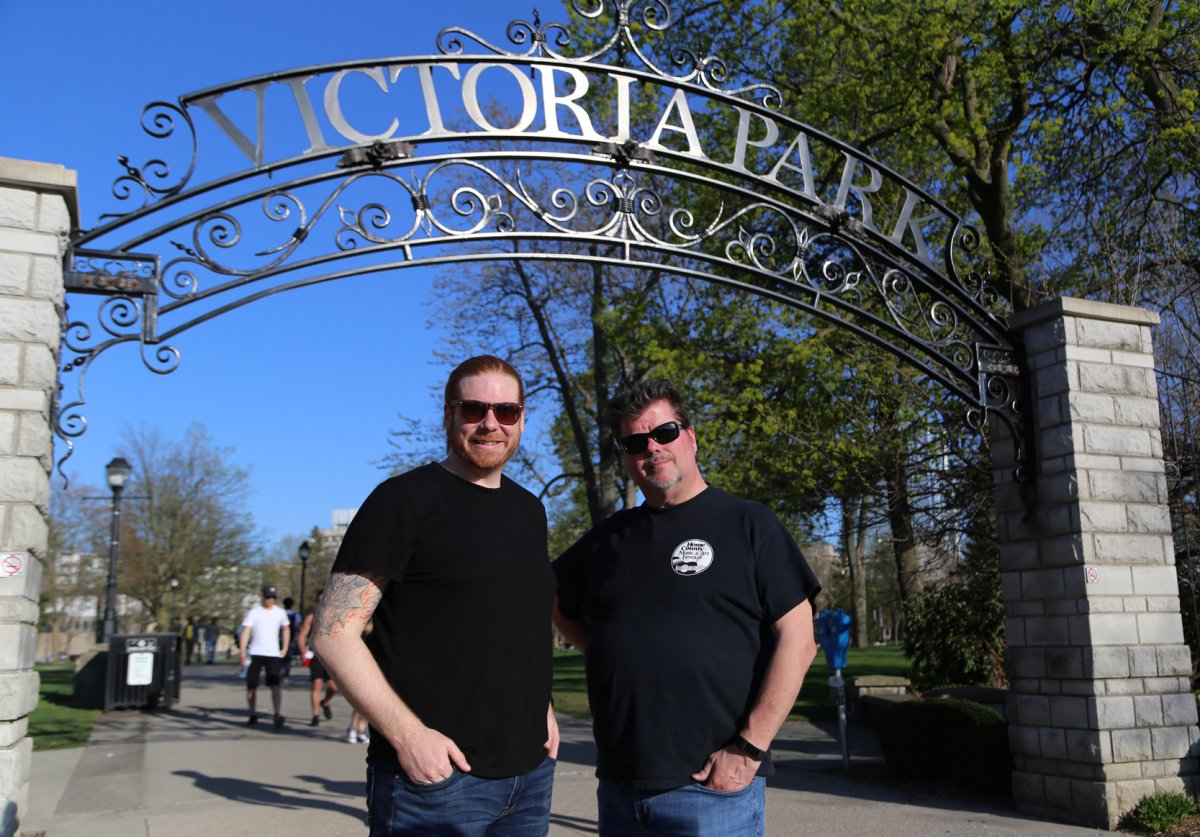 New artistic director Tim Fraser (left) stands with out-going director Darin Addison (right) at Victoria Park.