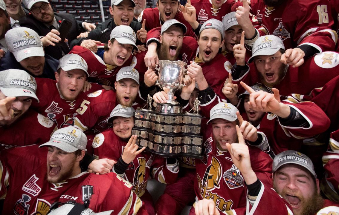 Members of the Acadie-Bathurst Titan pose with the Memorial Cup after defeating the Regina Pats in the Memorial Cup final in Regina on Sunday, May 27, 2018. 