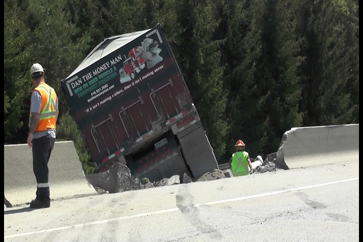 The transport crashed through a concrete barrier.