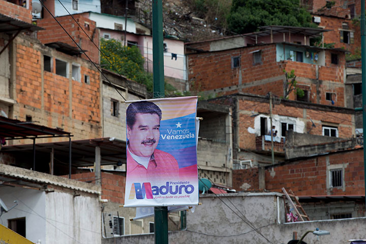 A presidential election campaign sign of Venezuelan President Nicolas Maduro hangs in the neighbourhood of San Agustin in Caracas, Wednesday, May 16, 2018. 