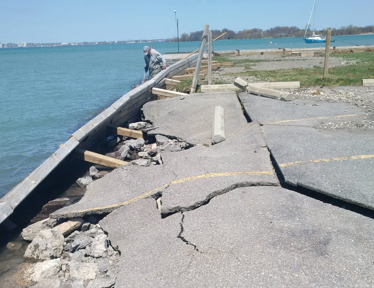 Two-foot high waves crashing against the Wolfe Island shoreline caused extensive damage to docks and parking lots on May 5.