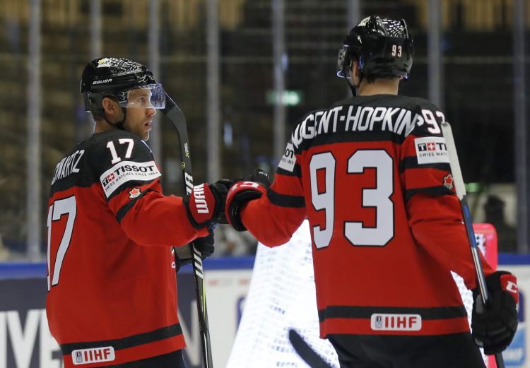 Canada’s Ryan Nugent-Hopkins, right, celebrates with teammate Jaden Schwartz, left, after scoring his sides first goal.