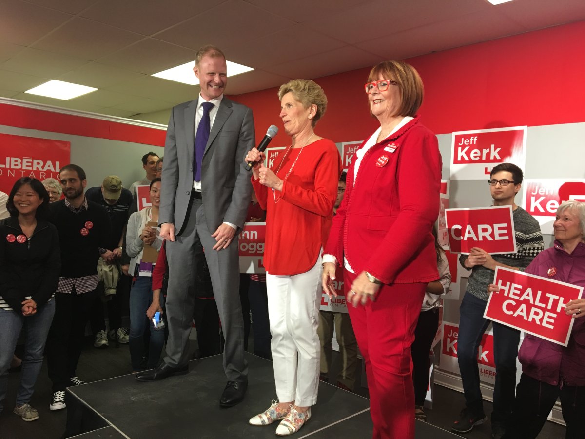 Ontario Liberal Party Leader Kathleen Wynne (centre), alongside Jeff Kerk (left) and Ann Hoggarth (right), speaks to a crowd of supporters in Barrie.