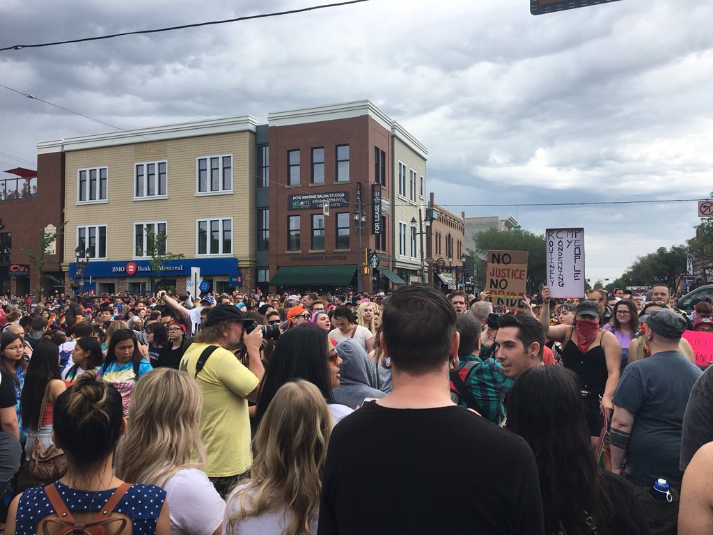 Demonstrators temporarily halt the Edmonton Pride Parade with some demands for organizers. June 9, 2018.