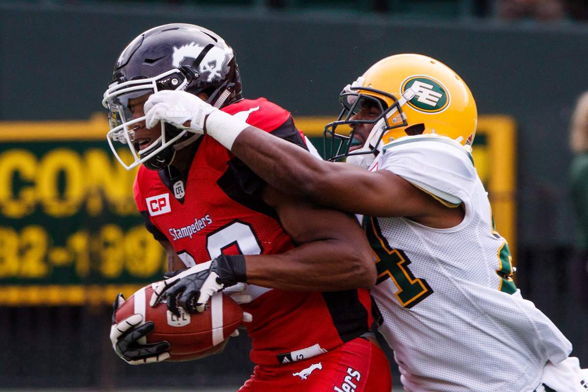 Calgary Stampeders Kamar Jorden (88) Edmonton Eskimos Brandyn Thompson (24) during first half CFL pre-season action in Edmonton, Alta., on Sunday June 11, 2017. 