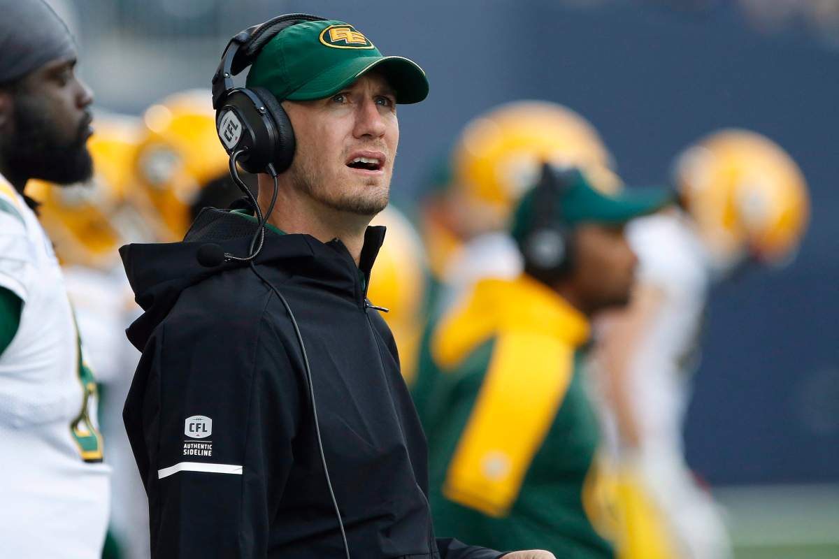 Edmonton Eskimos head coach Jason Maas looks up at the scoreboard during the first half of pre-season CFL action against the Winnipeg Blue Bombers in Winnipeg Friday, June 1, 2018.