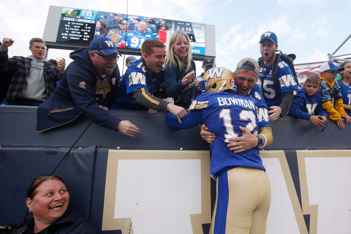Winnipeg Blue Bombers' Adarius Bowman (12) celebrates his touchdown with fans during the first half of pre-season CFL action against the Edmonton Eskimos in Winnipeg Friday, June 1, 2018. THE CANADIAN PRESS/John Woods.