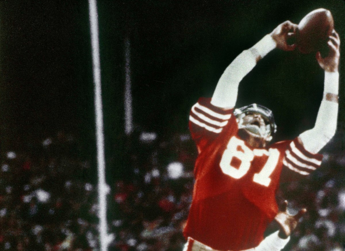 In this Jan. 10, 1982, file photo, San Francisco 49ers wide receiver Dwight Clark makes "The Catch," a pass from Joe Montana that tied the game, late in the fourth quarter against the Dallas Cowboys in the NFC championship football game at Candlestick Park in San Francisco. 