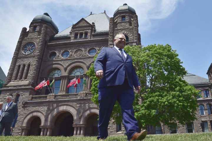 Ontario premier-elect Doug Ford walks out onto the front lawn of the Ontario Legislature at Queen's Park in Toronto on Friday, June 8, 2018. 