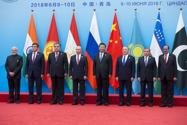 From left: Indian Prime Minister Narendra Modi, Kyrgyz President Sooronbay Jeenbekov, Tajikistan President Imomali Rakhmon, Russian President Vladimir Putin, Chinese President Xi Jinping, Kazakh President Nursultan Nazarbayev, Uzbekistan’s President Shavkat Mirziyoyev and Pakistani President Mamnoon Hussain pose for a photo prior to their talks at the Shanghai Cooperation Organization (SCO) Summit in Qingdao, China, June 10, 2018. (AP Photo/Alexander Zemlianichenko)