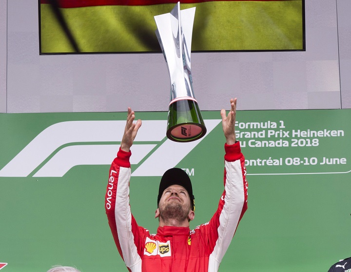 Ferrari driver Sebastian Vettel of Germany celebrates after winning the Canadian Grand Prix Sunday, June 10, 2018 in Montreal.