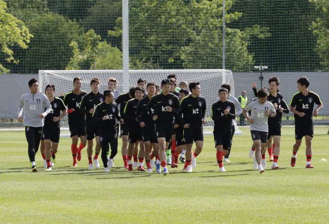 South Korea’s national soccer team players run during a training session at the Spartak Stadium in Lomonosov near St. Petersburg, Russia, June 13, 2018.