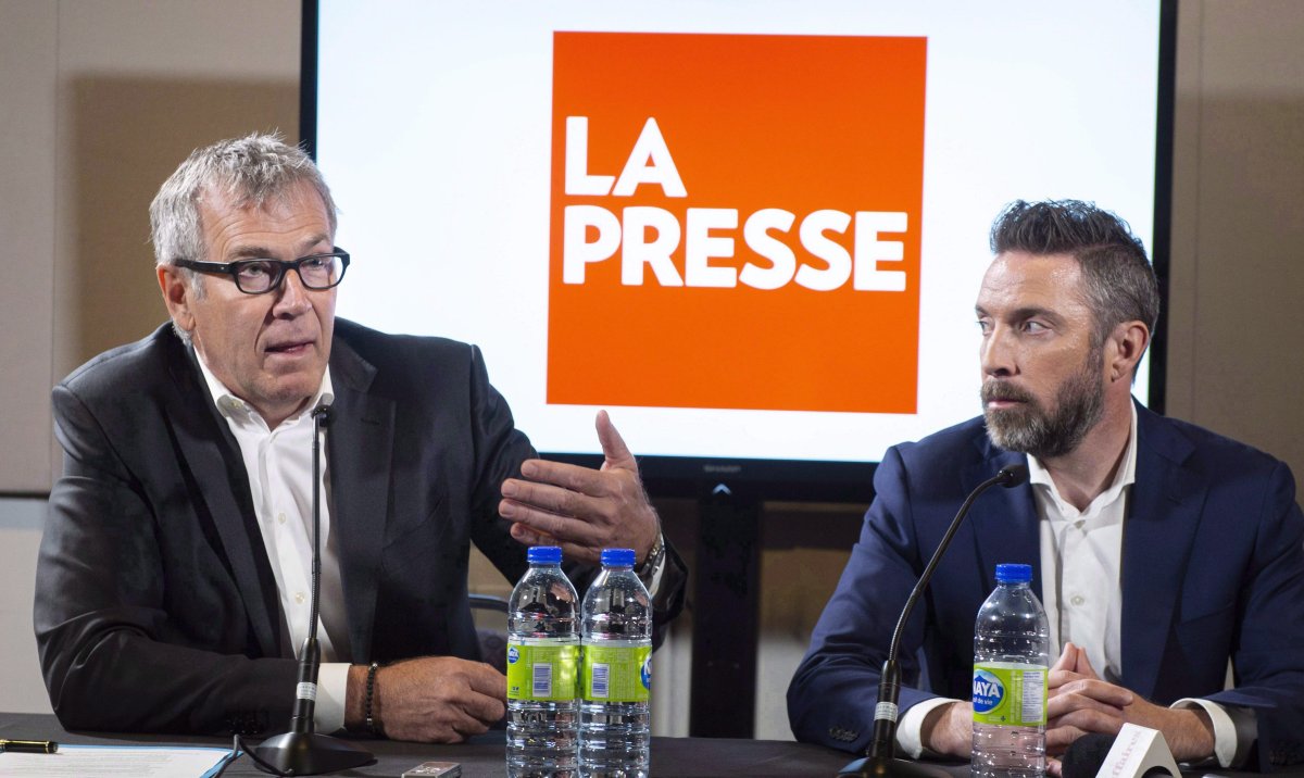 La Presse publisher Guy Crevier, left, responds to a question as president Pierre-Elliott Levasseur looks on during a news conference Tuesday, May 8, 2018 in Montreal. The Quebec government will invoke closure later today to ram through legislation aimed at allowing Montreal-based La Presse news group to adopt a not-for-profit structure.Government house leader Jean-Marc Fournier made the announcement this morning. 