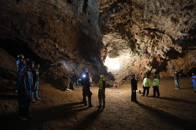 Rescue teams gather in a deep cave where a group of boys went missing in Chang Rai, northern Thailand, Monday, June 25, 2018.