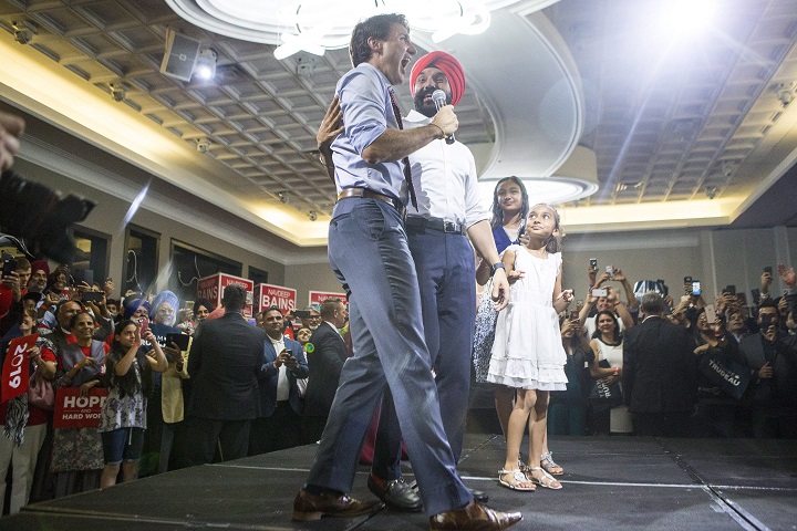 Prime Minister Justin Trudeau appears onstage with Liberal MP Navdeep Bains during a nomination event in Mississauga, Ont., on Wednesday, June 27, 2018. Bains is being nominated as the Liberal candidate for Mississauga-Milton for the 2019 general election. 