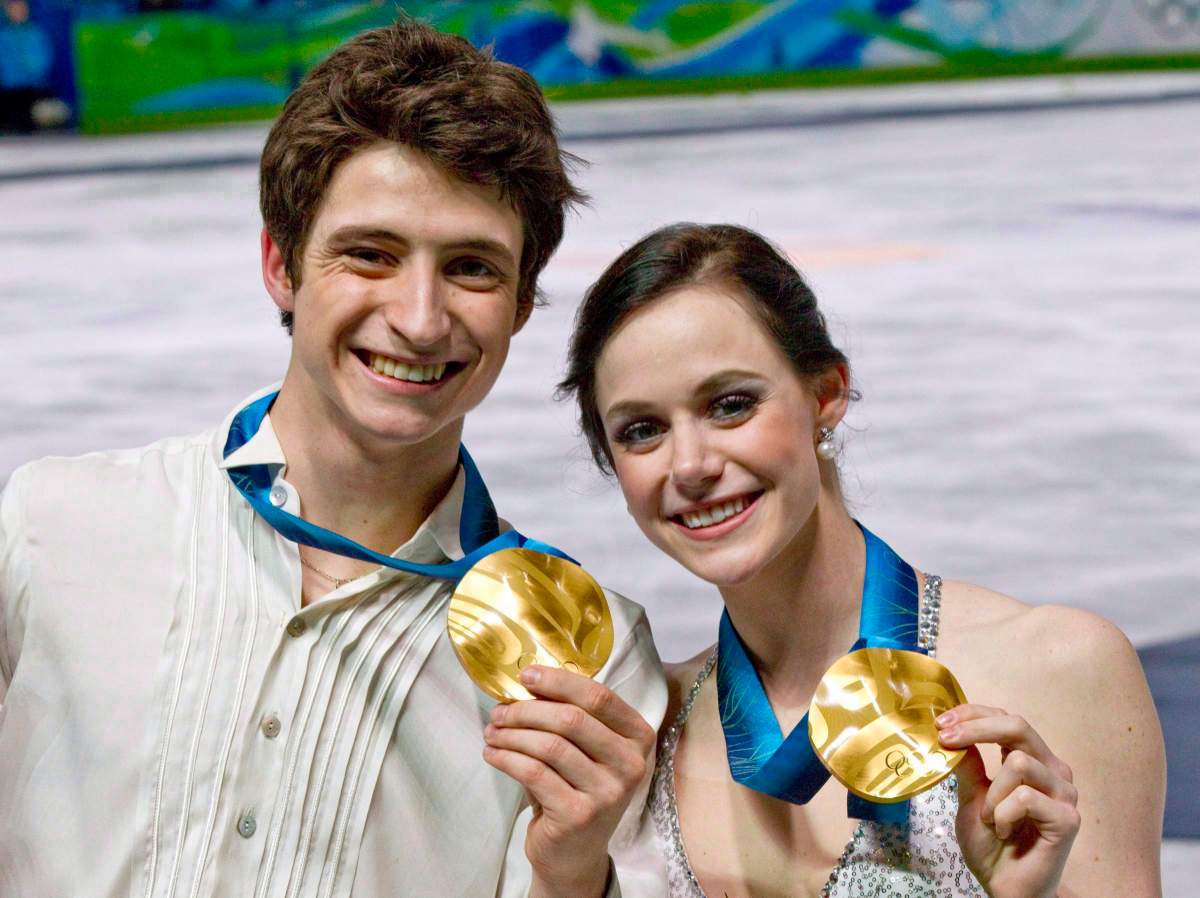 Ice dance gold medalists Canada’s Tessa Virtue and Scott Moir pose with their medals during victory ceremonies Monday February 22, 2010 at the 2010 Vancouver Olympic Winter Games in Vancouver.