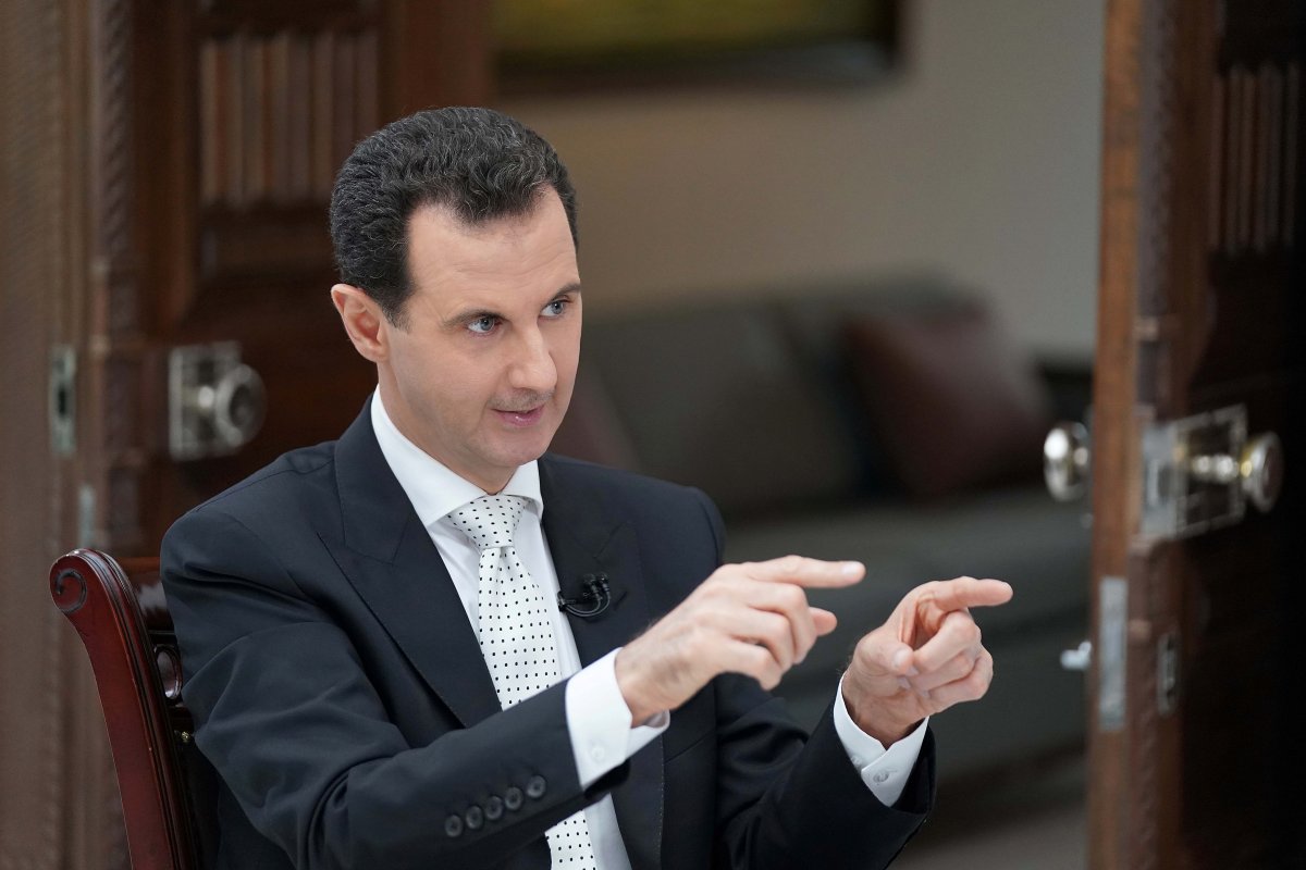 Syria's President Bashar al Assad gestures during an interview with a Greek newspaper in Damascus, Syria in this handout released May 10, 2018. 