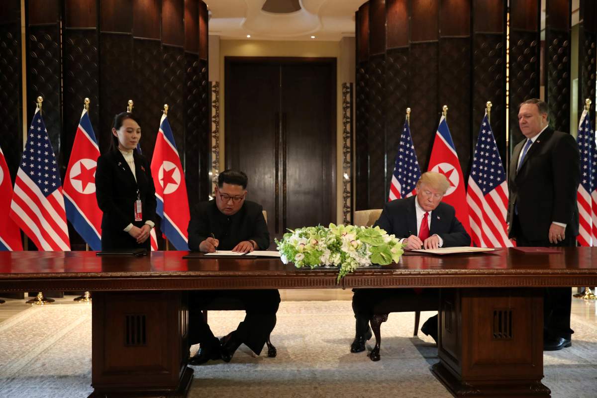 U.S. President Donald Trump and North Korea’s leader Kim Jong Un sign documents that acknowledge the progress of the talks and pledge to keep momentum going, after their summit at the Capella Hotel on Sentosa island in Singapore June 12.