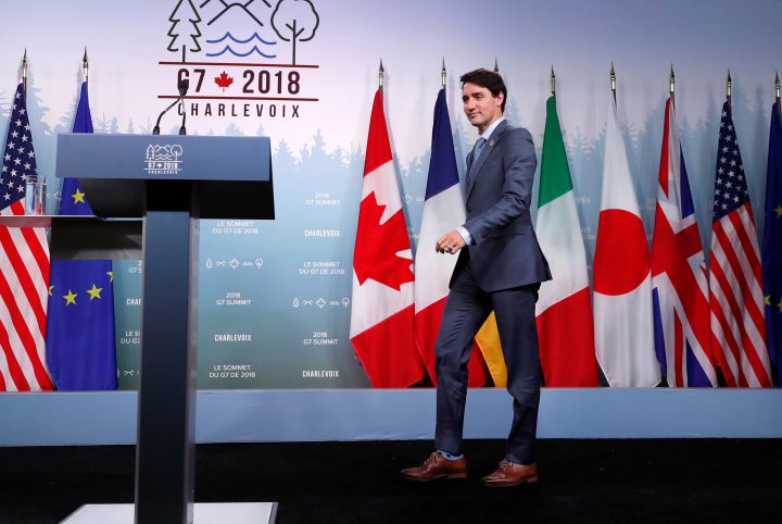 Justin Trudeau walks to the podium to address the final news conference of the G7 summit in the Charlevoix city of La Malbaie, Quebec, Canada, June 9, 2018. 