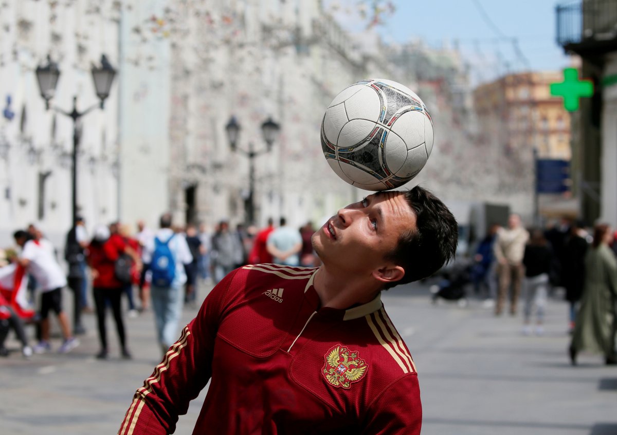A man wearing a Russian national soccer team jersey performs with a ball on the eve of the 2018 FIFA World Cup, in central Moscow, Russia, on June 14, 2018. 