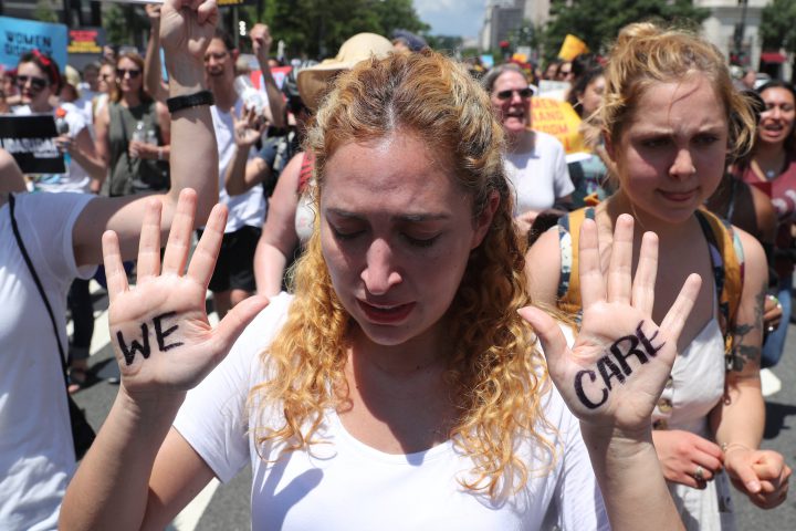 A demonstrator shows a sign on her hands during a rally and march calling for "an end to family detention" and in opposition to the immigration policies of the Trump administration in Washington, U.S., June 28, 2018. 