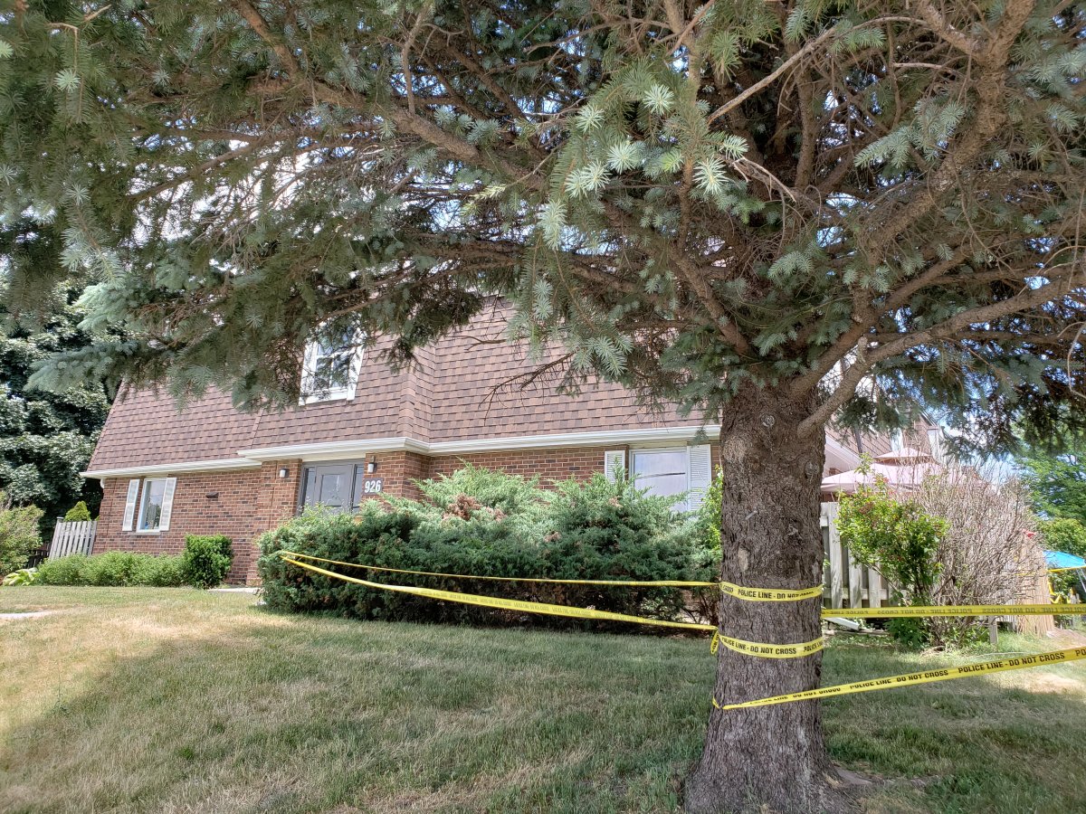Police tape can be seen cordoning off an area of the townhouse complex on Courtland Avenue.