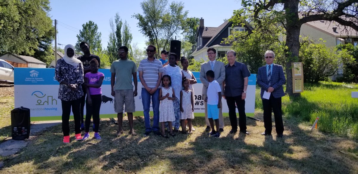 Several families, including the Mbayes (left),  will soon be able to purchase their very own affordable homes thanks to a Habitat for Humanity build in St. Boniface, which launched Wednesday.